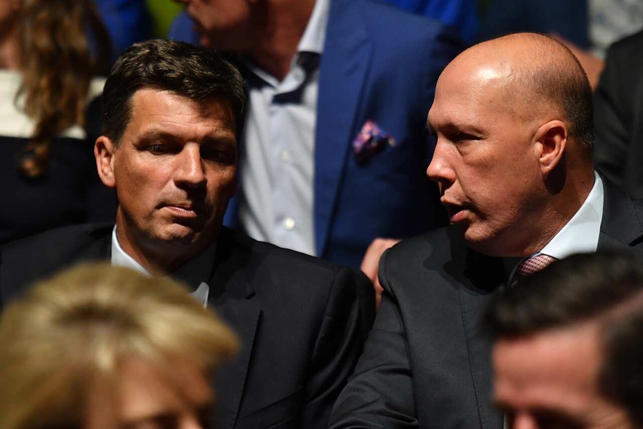 Minister for Energy Angus Taylor and Minister for Home Affairs Peter Dutton during the Liberal Party campaign launch for the 2019 Federal election at the Melbourne Convention Centre in Melbourne, Sunday, May 12, 2019. (AAP Image/Mick Tsikas) NO ARCHIVING
