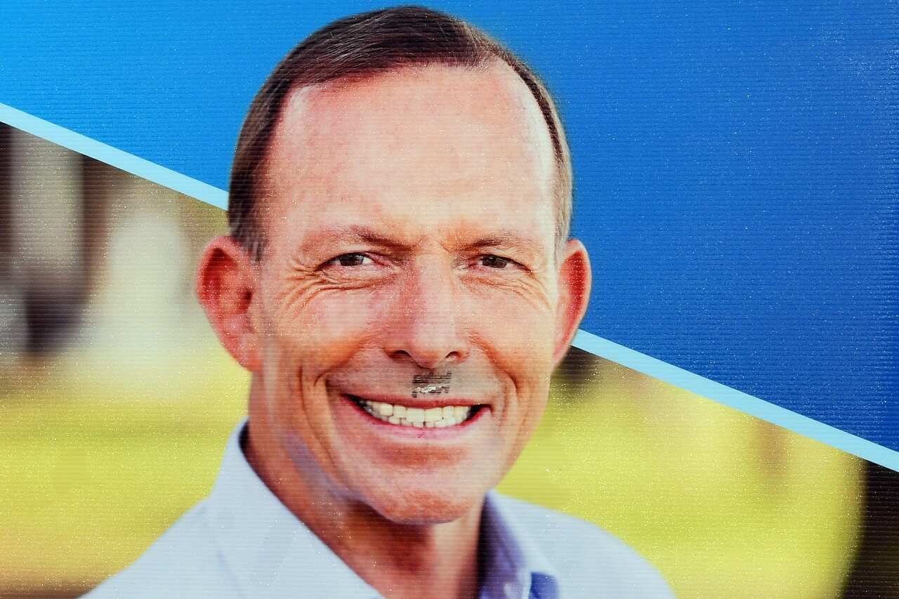 A Hitler mustache on a Tony Abbott poster.