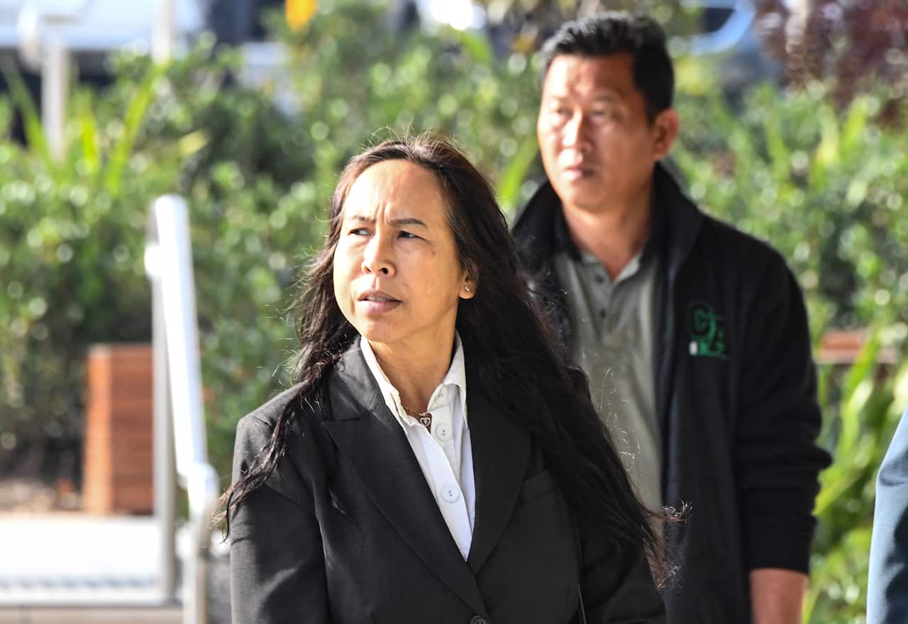 Supaporn Chomphoo, mother of Danukul Mokmool, arrives at the Lidcombe Coroners Court in Sydney.