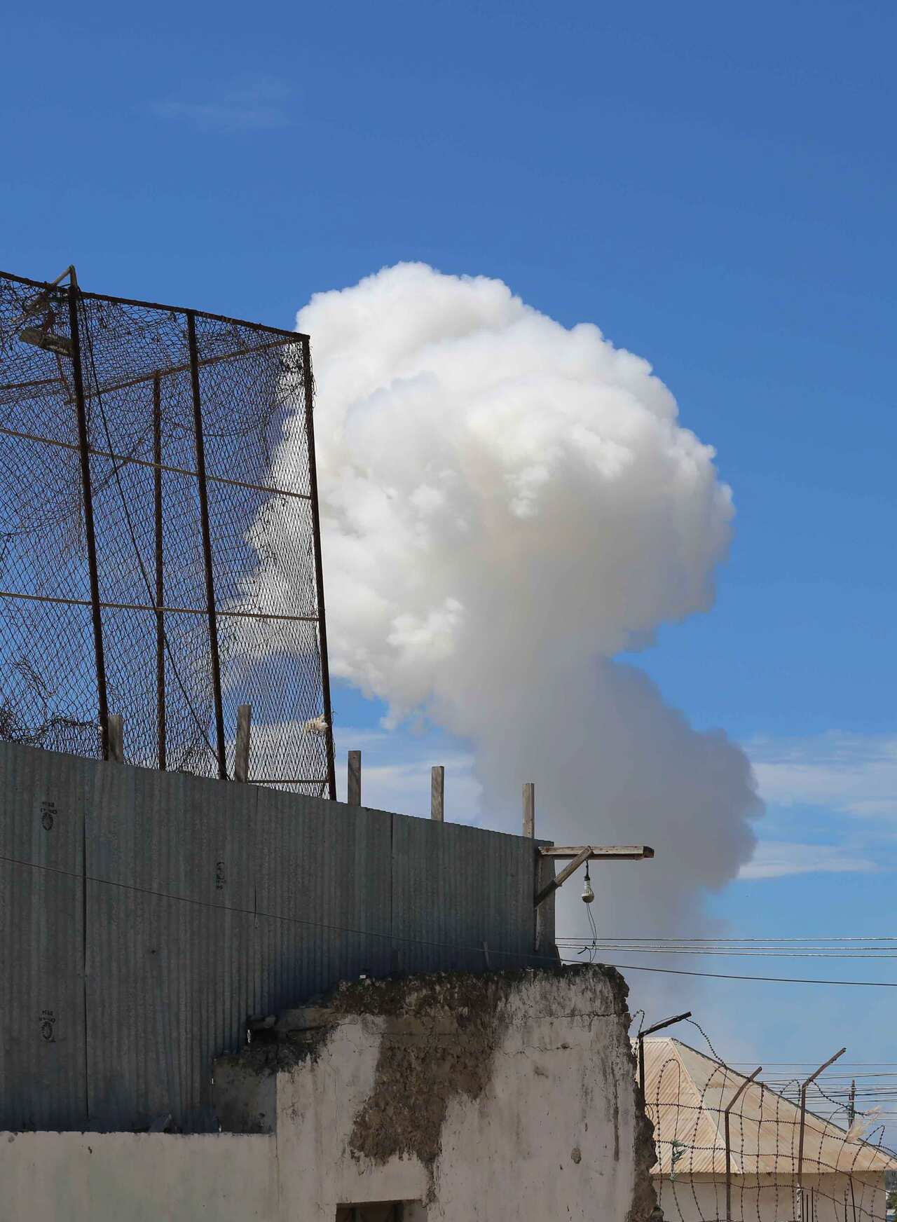 Smoke billows from a suspected explosion in Mogadishu.