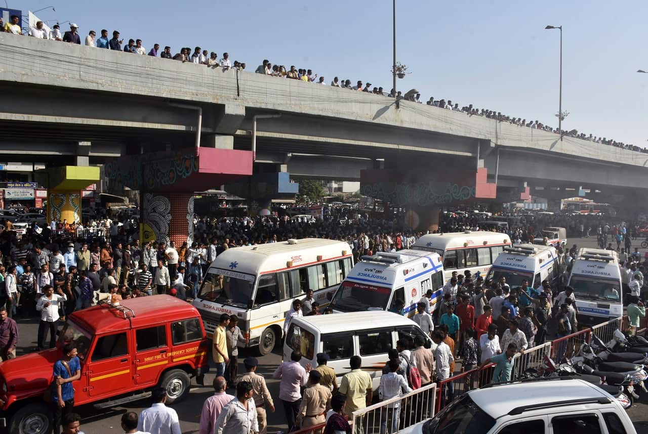 A crowd gathers to watch the fire.
