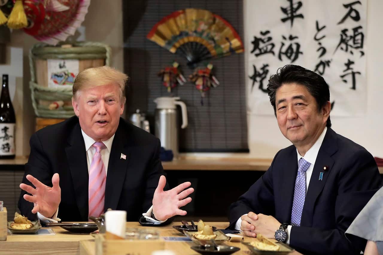 US President Donald Trump speaks as he dines with Japan's Prime Minister Shinzo Abe.