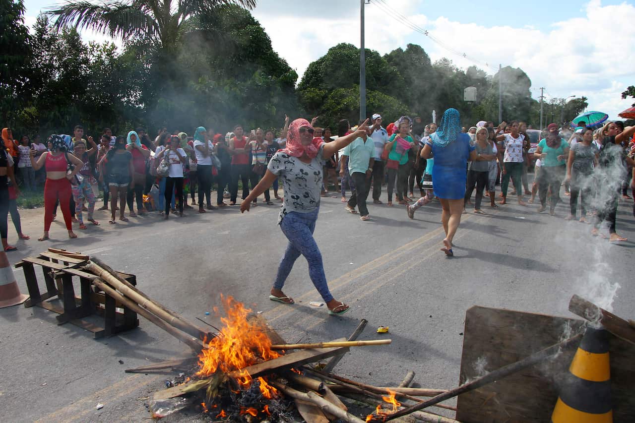 Relatives protest in front the Anisio Jobim Prison Complex after fighting erupted among inmates on May 26, 2019. 