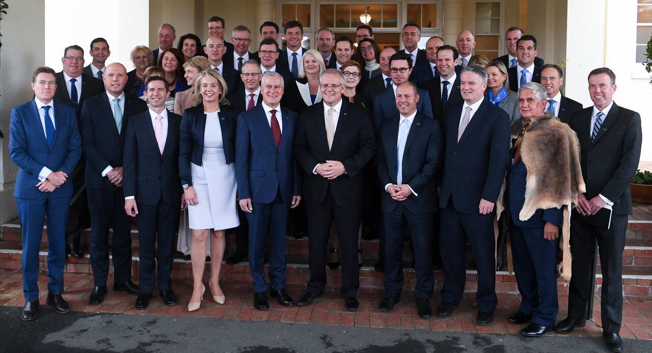 Prime Minister Scott Morrison poses for a photograph with his new ministry during the swearing in at Government House in Canberra, Wednesday, 29 May 2019.