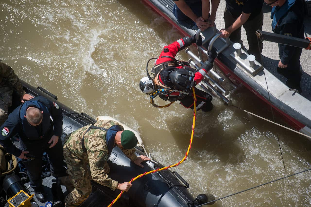 A diver prepares to dive to the wreckage.