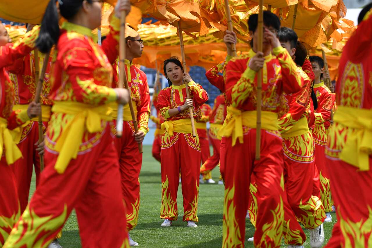 Chinese performers are seen before the start of the 2019 Round 11 AFL match between St Kilda and Port Adelaide at Jiangwan Stadium, Shanghai, China.