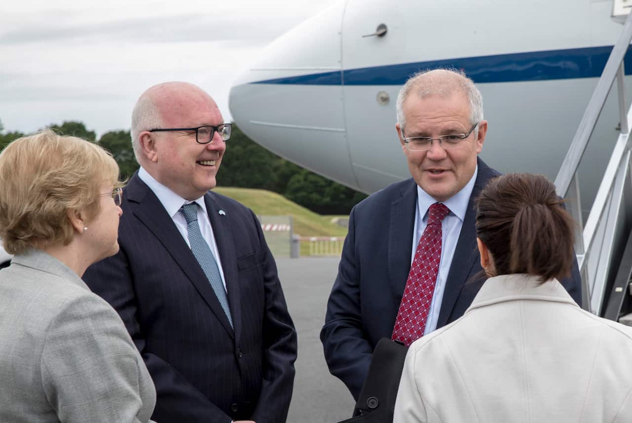 Prime Minister Scott Morrison arrives at Farnborough airport in England and is greeted by High Commissioner George Brandis.  