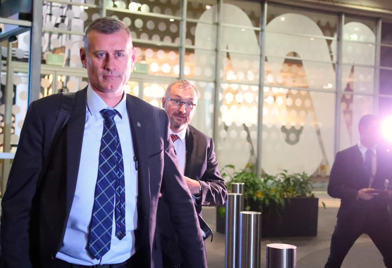 Two Australian federal Police officers walk out of the main entrance to the ABC building located at Ultimo in Sydney, Wednesday, June 5, 2019. (AAP Image/David Gray) NO ARCHIVING