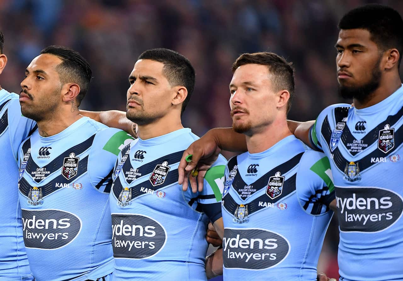 New South Wales players during the national anthem.