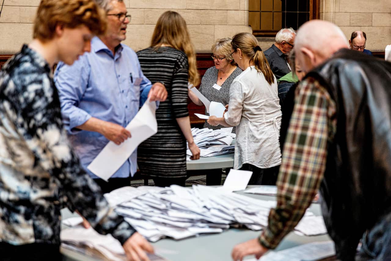 Ballots being counted after the polling stations closed in Copenhagen City Hall during the final day of the parliamentary elections in Denmark.