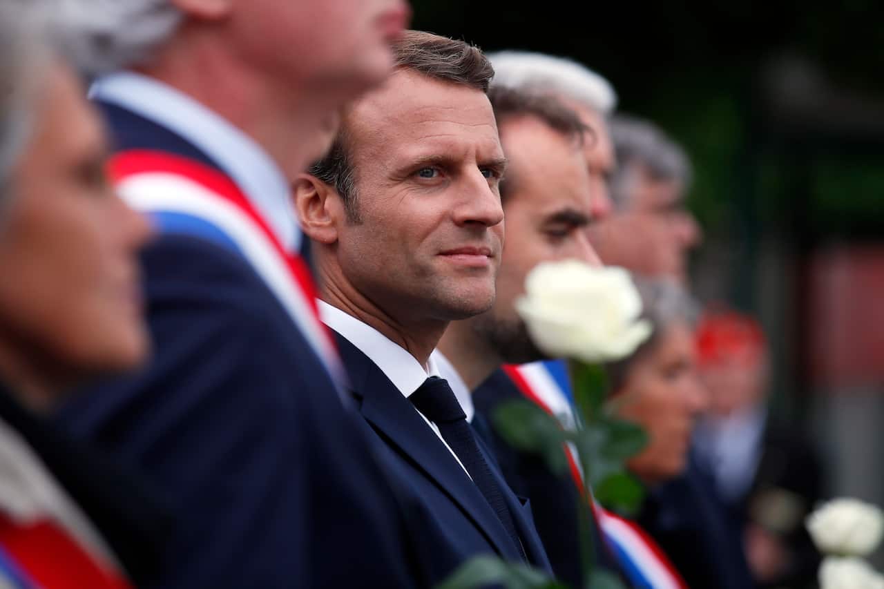 French President Emmanuel Macron attends a ceremony at the Caen prison to pay tribute to French resistants.