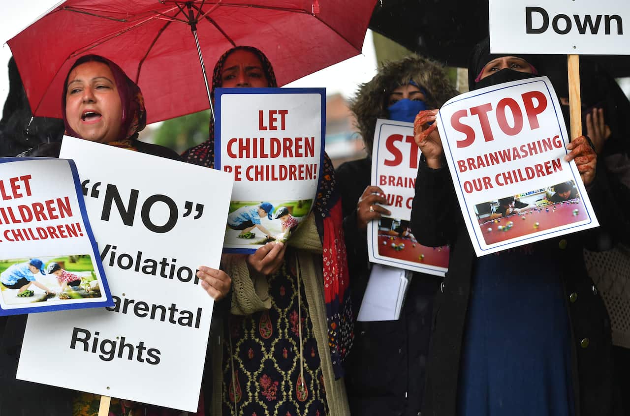 Protestors hold their first demonstration since an injunction barring action immediately outside Anderton Park Primary School, in Moseley, Birmingham.
