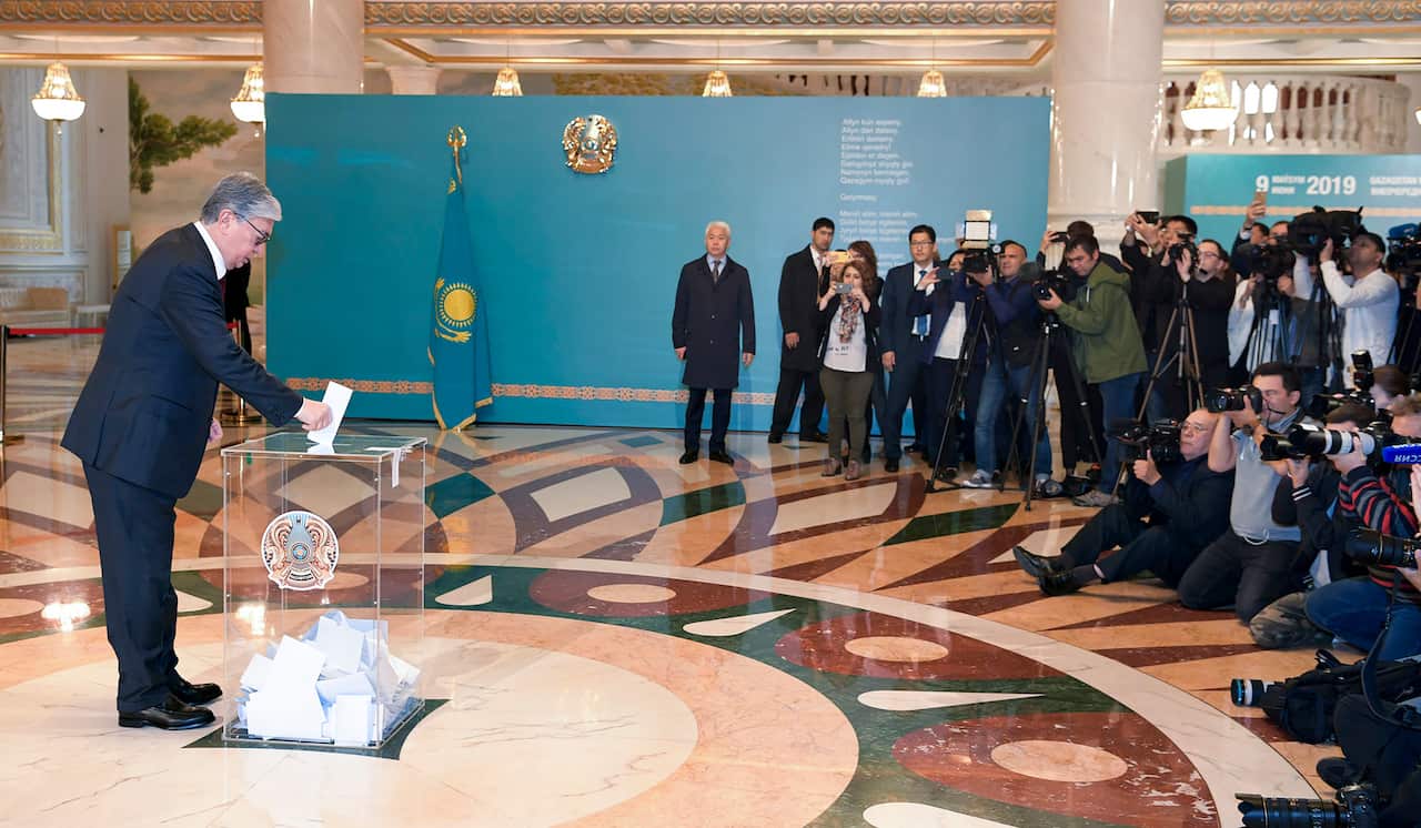 Kazakhstan's acting President Kassym-Jomart Tokayev casts his ballot at a polling station during the presidential elections in Nur-Sultan.