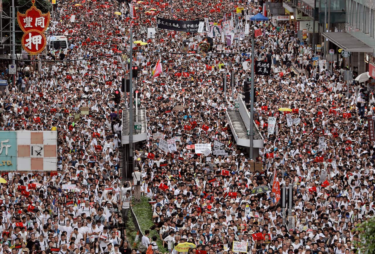 Protesters march along a downtown street against the extradition law on June 9. 