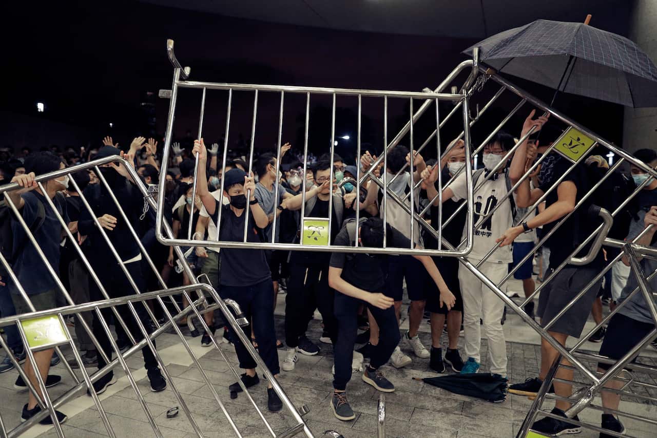 Protesters use barriers against the proposed amendments to the extradition law at the Legislative Council in Hong Kong