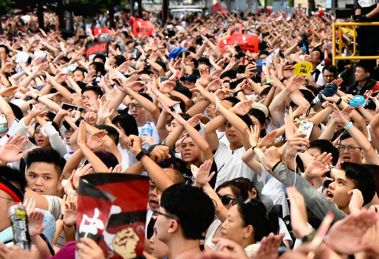 Hong Kong citizens march through the streets in a massive protest against China's extradition law.