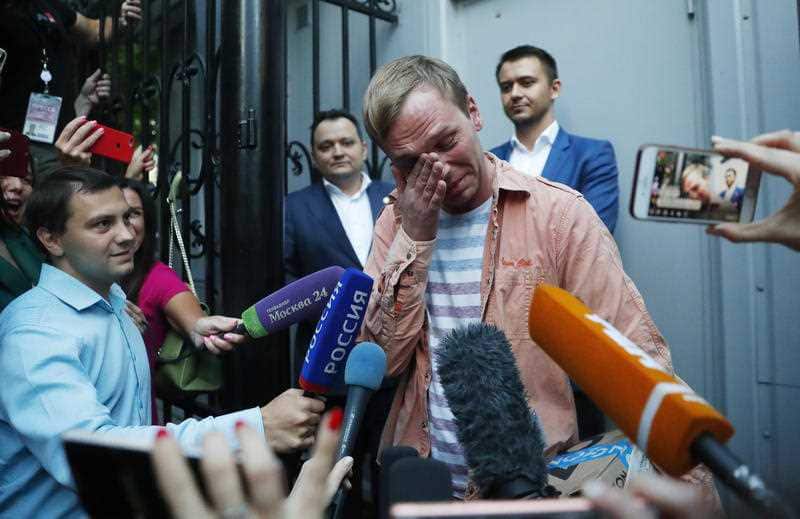Prominent Russian investigative journalist Ivan Golunov, cries as he leaves a Investigative Committee building in Moscow, Russia, Tuesday, June 11, 2019.