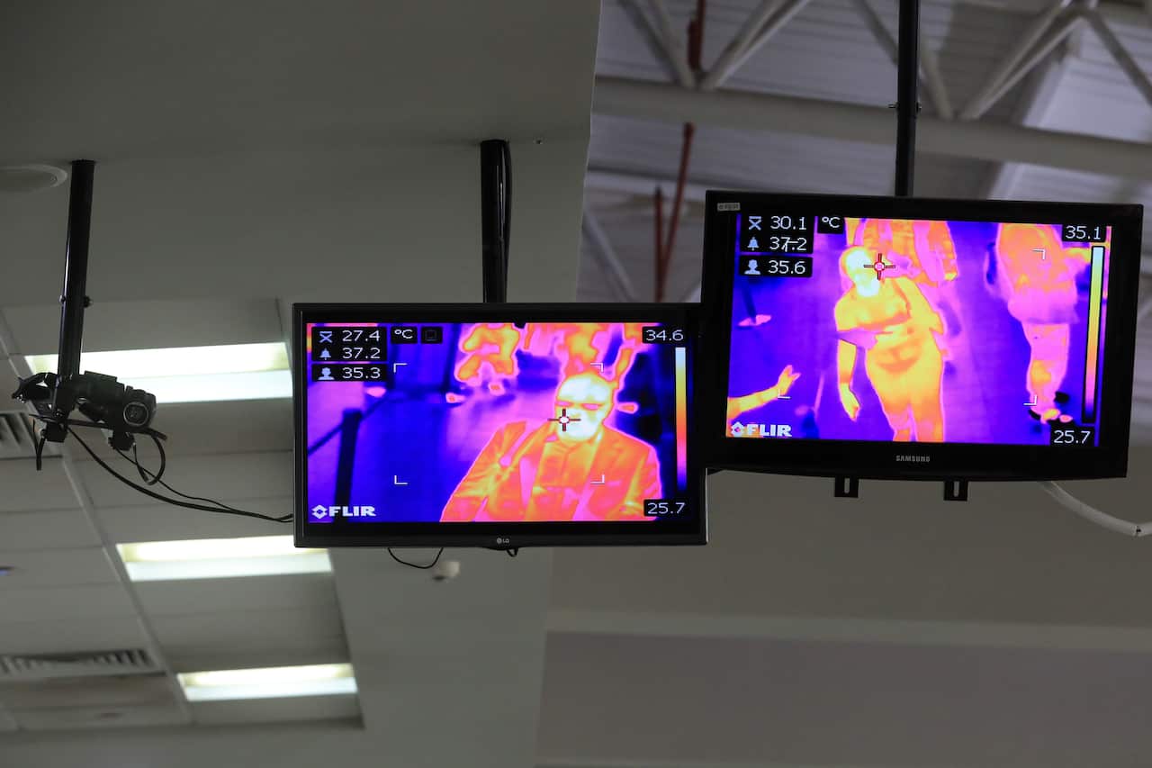 Travellers are being screened for temperatures using thermo cameras.