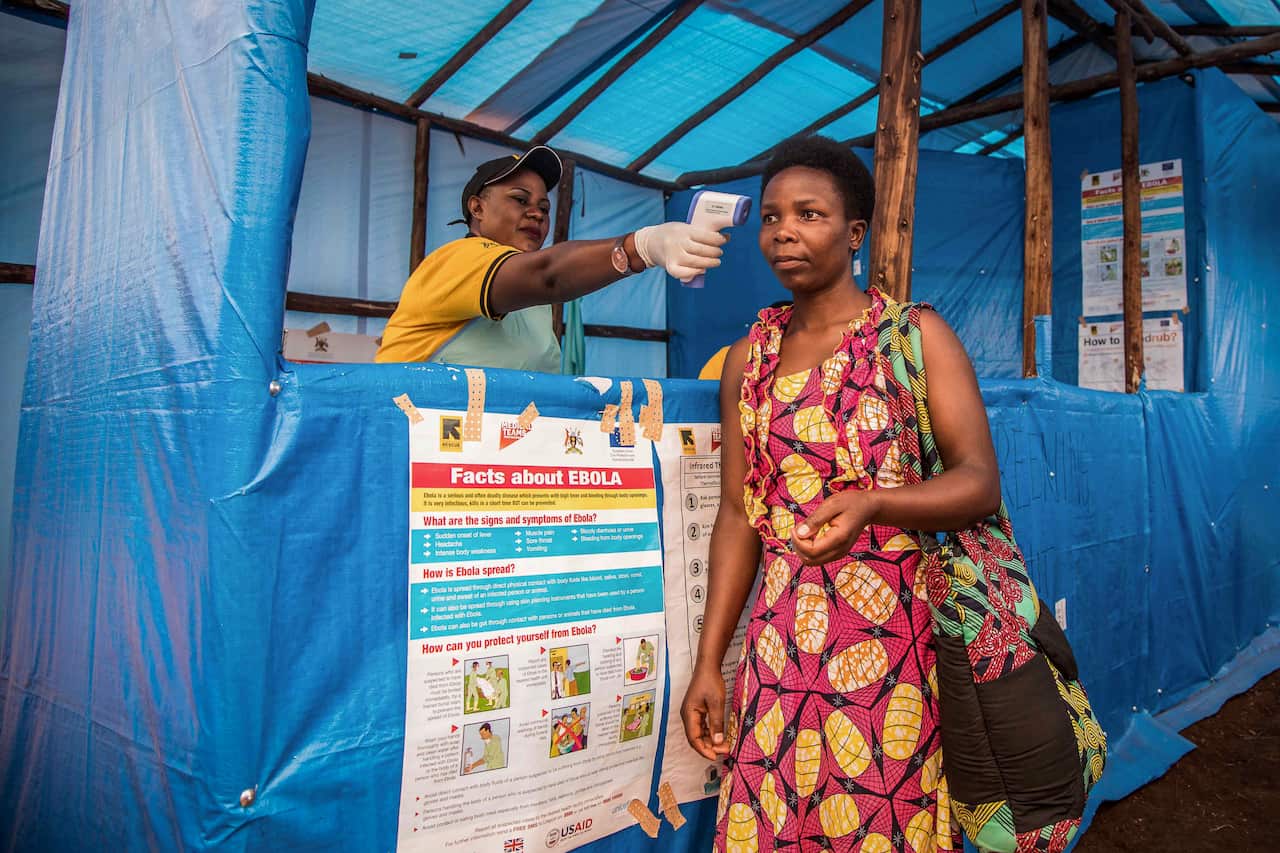 Congolese refugees are screened for Ebola symptoms at the IRC triage facility in the Kyaka II refugee settlement in western Uganda, Thursday, June 13, 2019