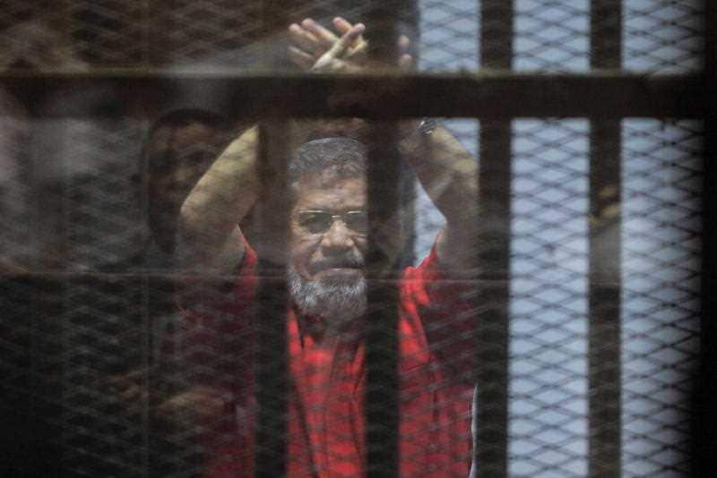 Ousted Egyptian President Mohamed Morsi looks on during a trial session on charges of espionage in Cairo, Egypt, 18 June 2016