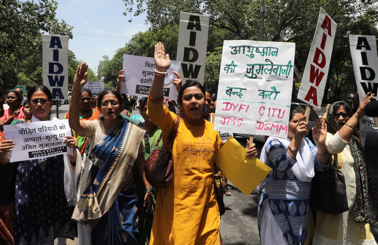 Indian activists protest the the death of children in the state of Bihar due to an outbreak of Encephalitis.