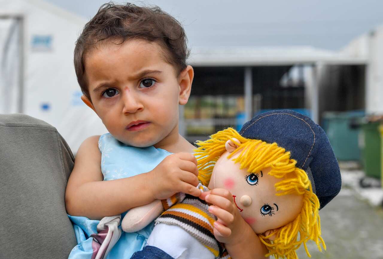 A two-year old Syrian refugee girl at the border between North Macedonia and Greece, near the southern city of Gevgelija, Republic of North Macedonia.