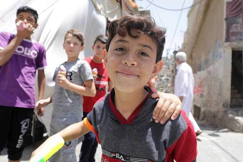 ids are playing in the Jabal Hussein Palestinian refugee camp, Amman, Jordan, 20 June 2019.