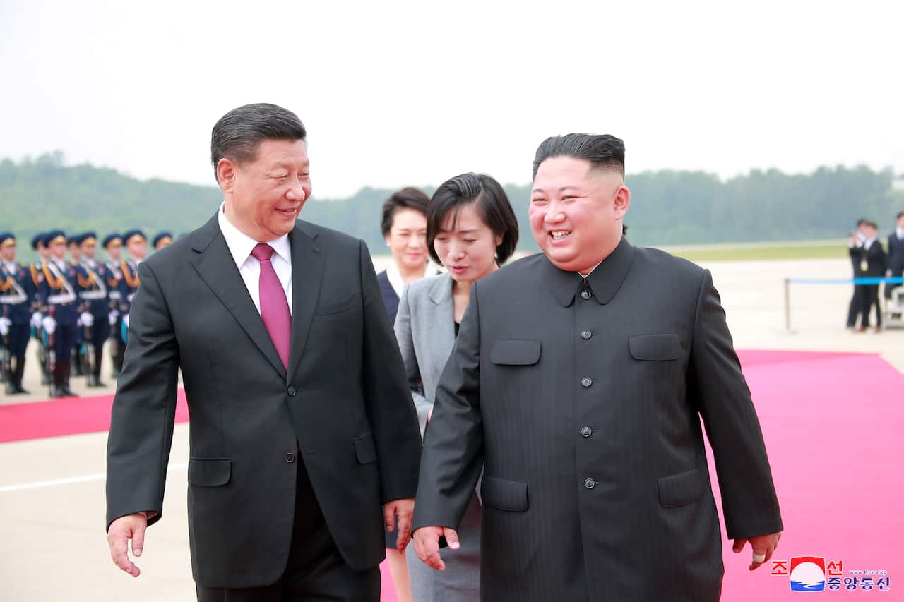 Kim Jong-Un  welcoming Xi Jinping as he arrives by his personal plane to pay a state visit to the DPRK, in Pyongyang, North Korea, 20 June 2019.