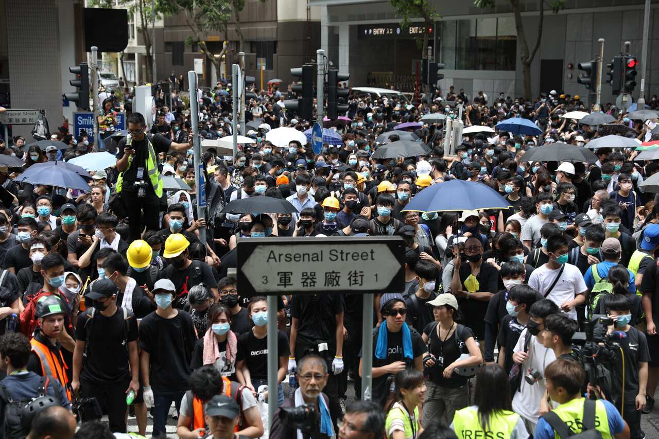 Protesters gather outside the Wanchai Police headquarters demanding the release of protesters arrested during clashes in Hong Kong, China.