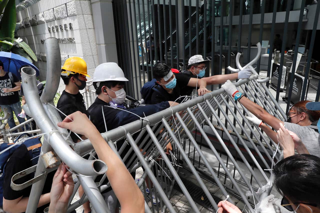 Protestors barricade the entrance to the police headquarters in Hong Kong on Friday, June 21, 2019.