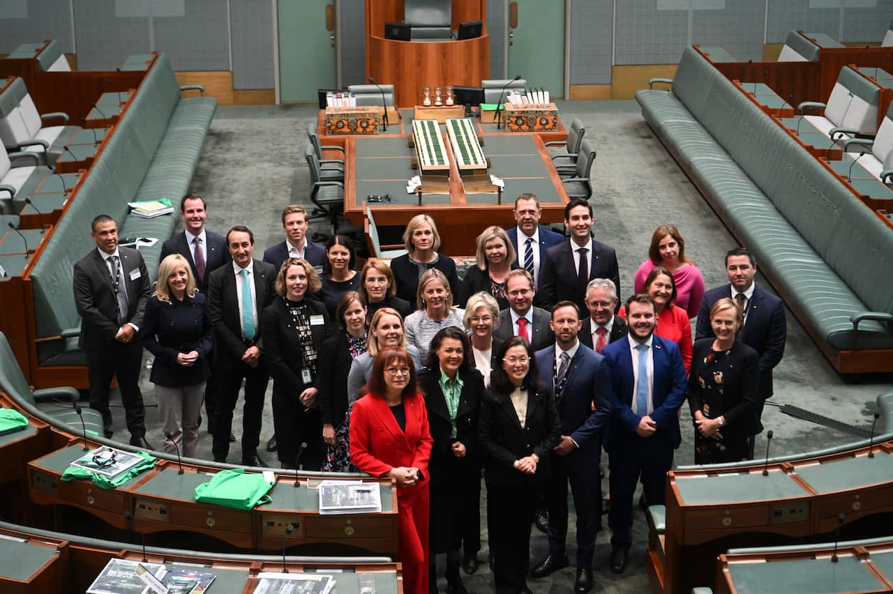 Newly elected MPs pose for photographs during a new Members' Seminar in the House of Representatives at Parliament House