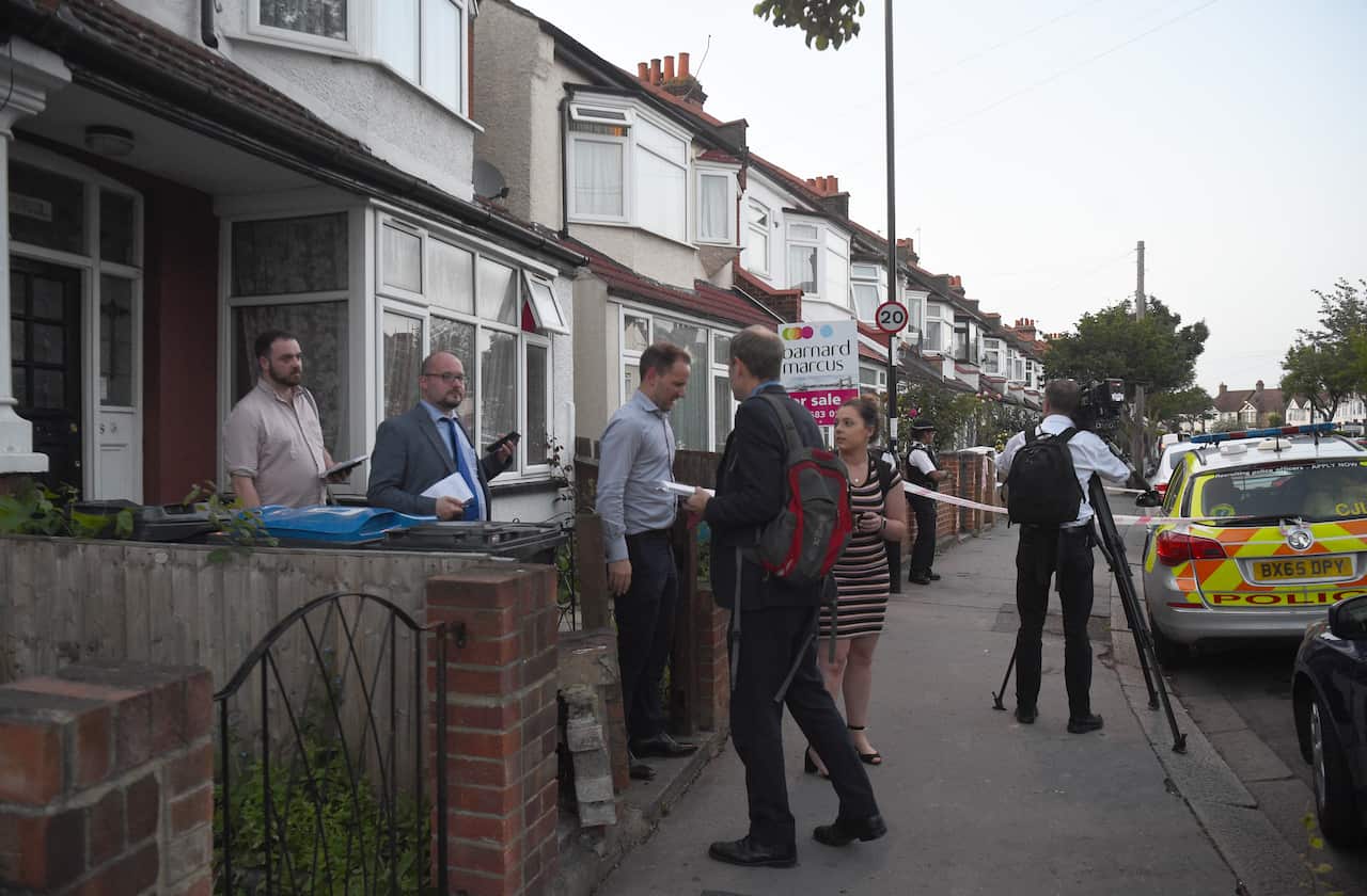 Police officers carrying door to door inquiries in Raymead Avenue, Thornton Heath, Croydon