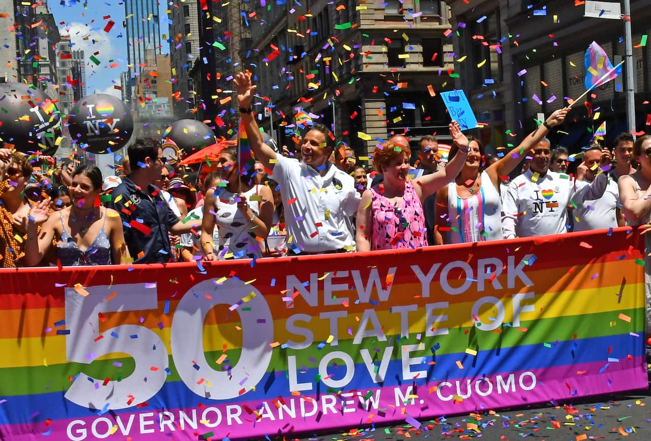 New York Governor Andrew Cuomo marches down Fifth Avenue in Manhattan at the World Pride Day parade marking the 50th anniversary of the Stonewall uprising.