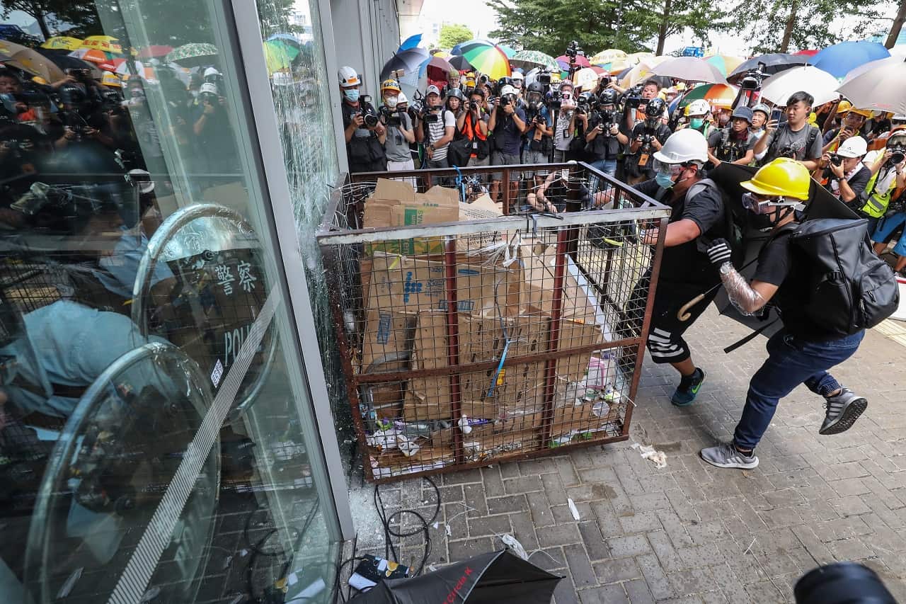 Protesters smash window of the Legislative Council in Hong Kong.