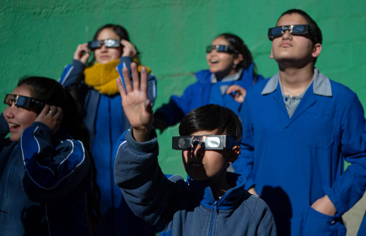 Town officials distributed more than 2000 cardboard-frame protective eyeglasses at local schools.