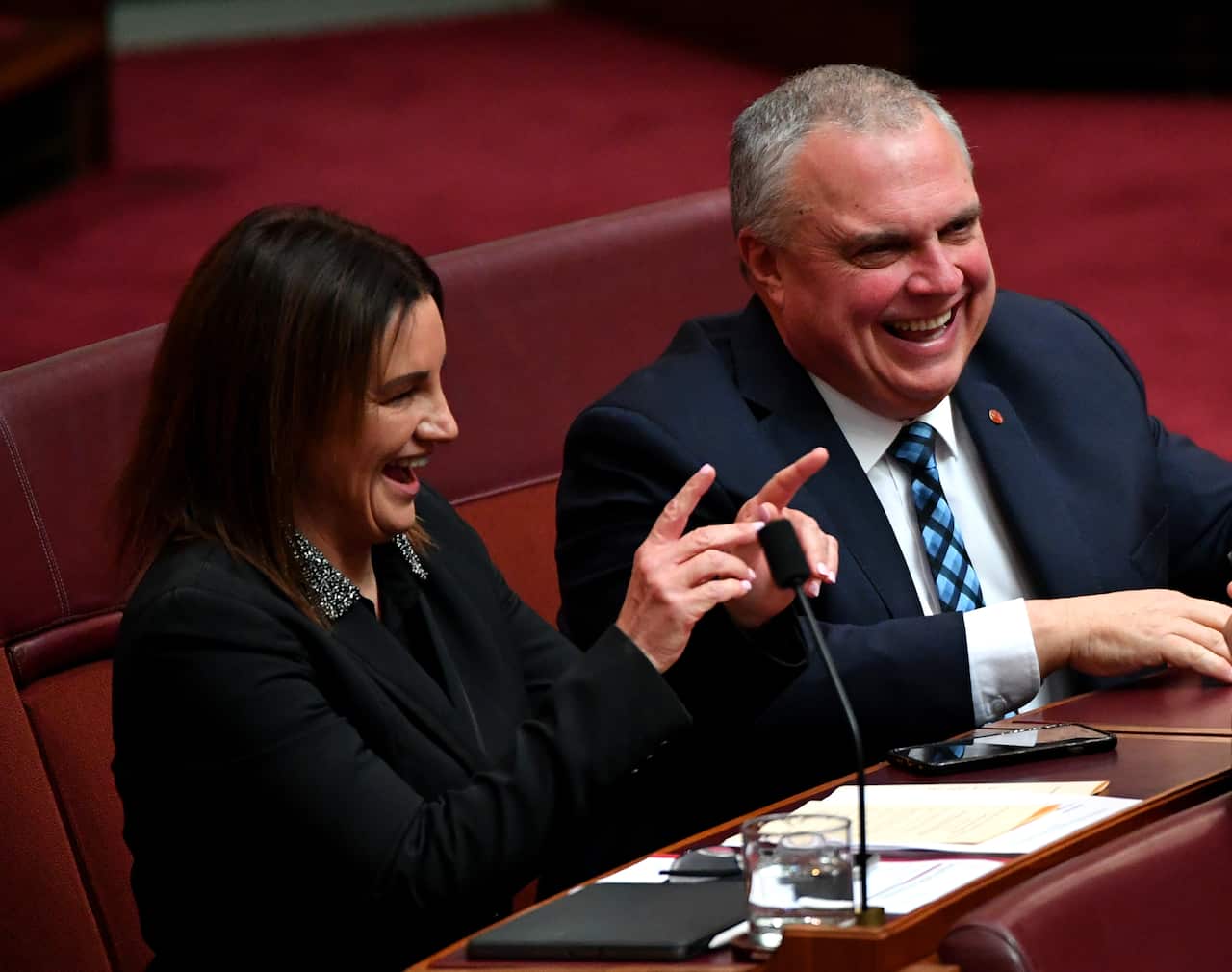 Senator Jacqui Lambie (left) and Central Alliance Senator Stirling Griff are seen in the Senate during the start of the 46th Parliament at Parliament House in Canberra, Tuesday, 2 July 2019. (AAP Image/Sam Mooy) NO ARCHIVING
