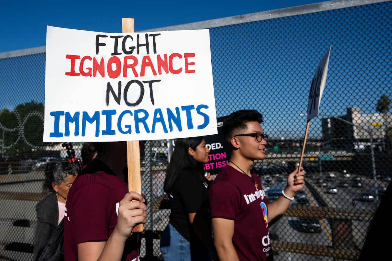 Protesters honour migrants who have died while attempting to cross the border into the US