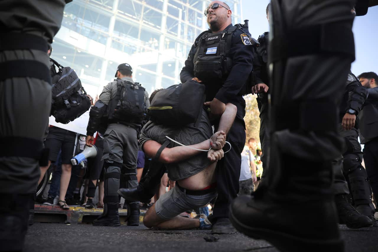 Police arrest a a man during a protest in Tel Aviv, Israel, Wednesday, July 3, 2019.