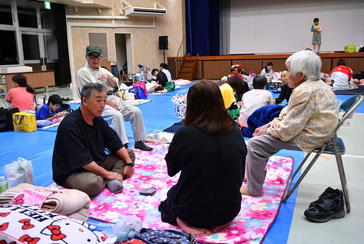 Local residents evacuate at a community hall in Kriyama Town, Kagoshima Prefecture, southwest of Japan.