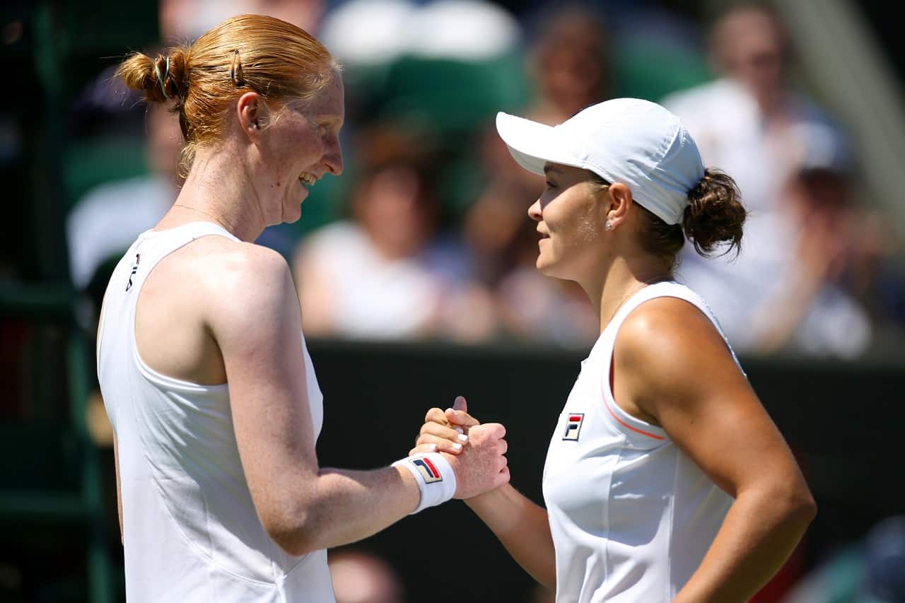 Ashleigh Barty (right) shakes hands with Alison Van Uytvanck after winning her match.