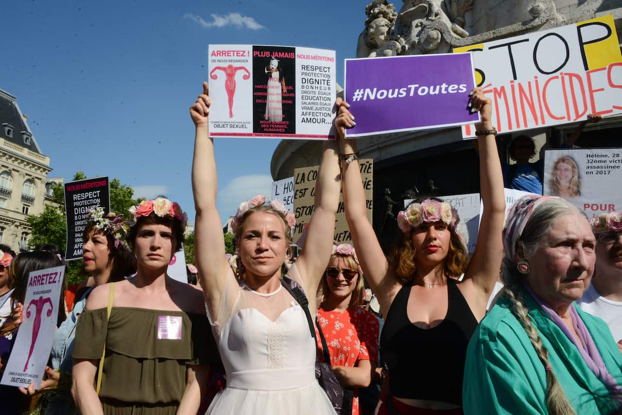 PHOTO: Protestors hold placards during a demonstration against violences against women in Paris, France on 6 July 2019.