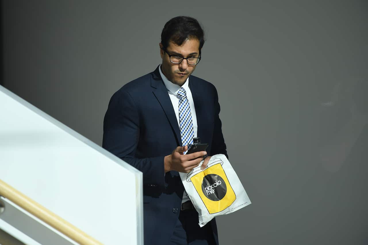 Dr Andrew Beshara leaves a coronial inquest into drug-related deaths at music festivals in NSW.