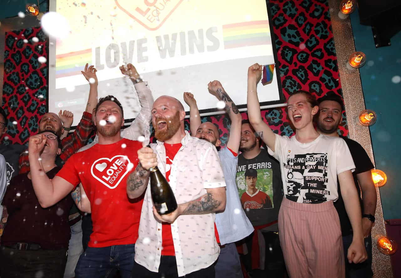 Members of the LGBT community celebrate at the Maverick bar, Belfast