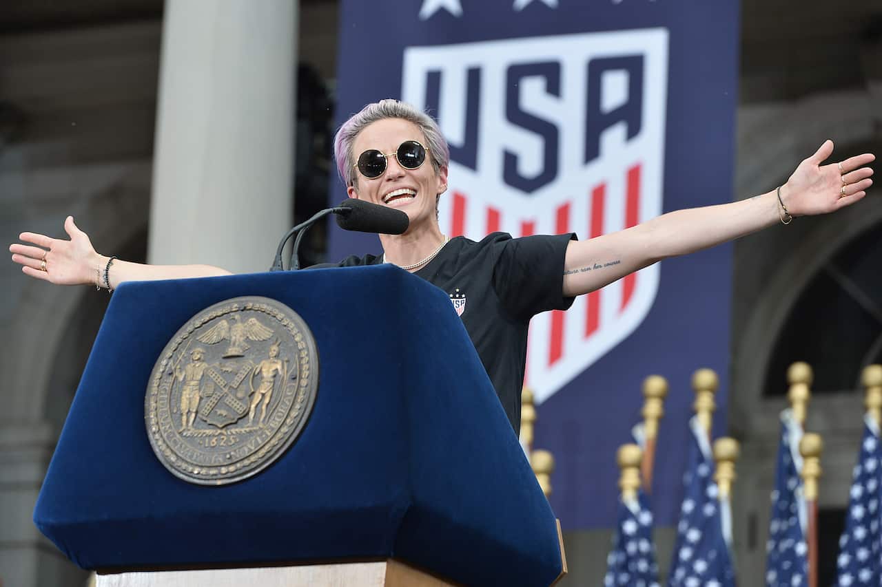 "Love more, hate less," US women's football team co-captain Megan Rapinoe told crowds. 