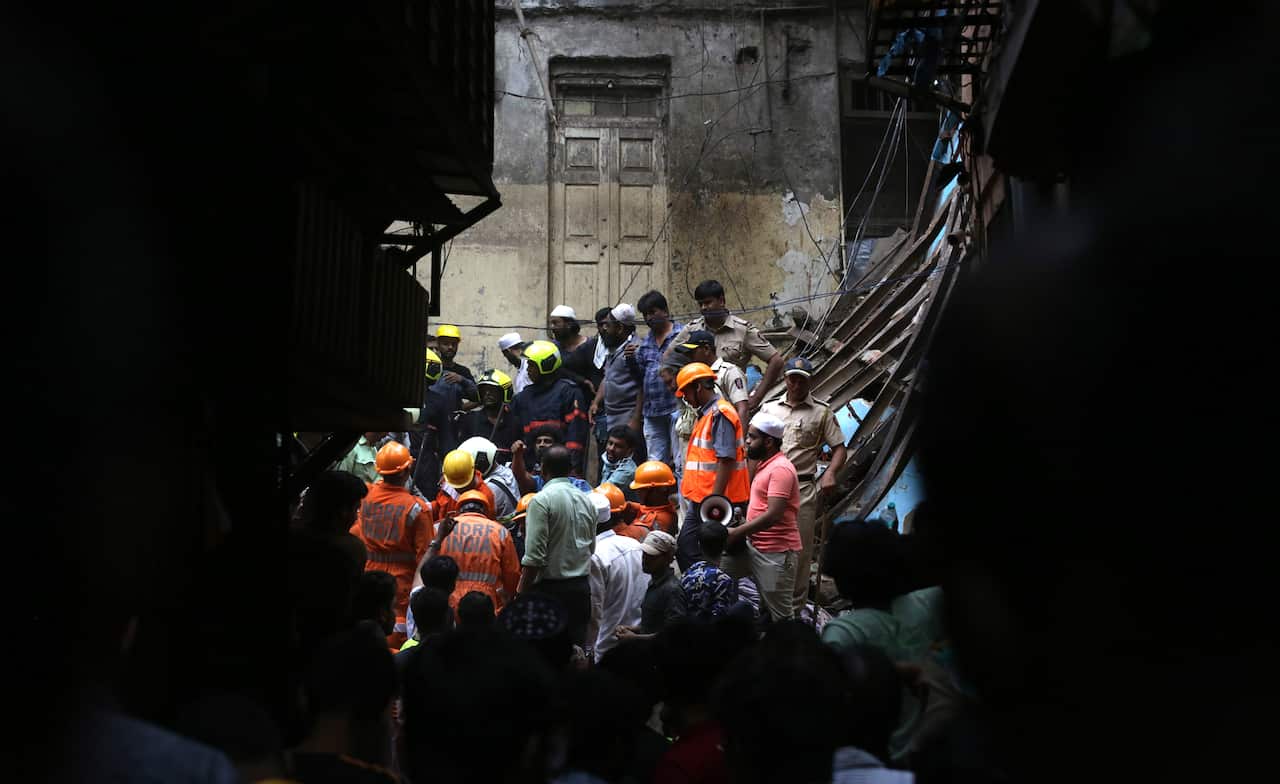 Rescuers at the site of a collapsed building in Mumbai