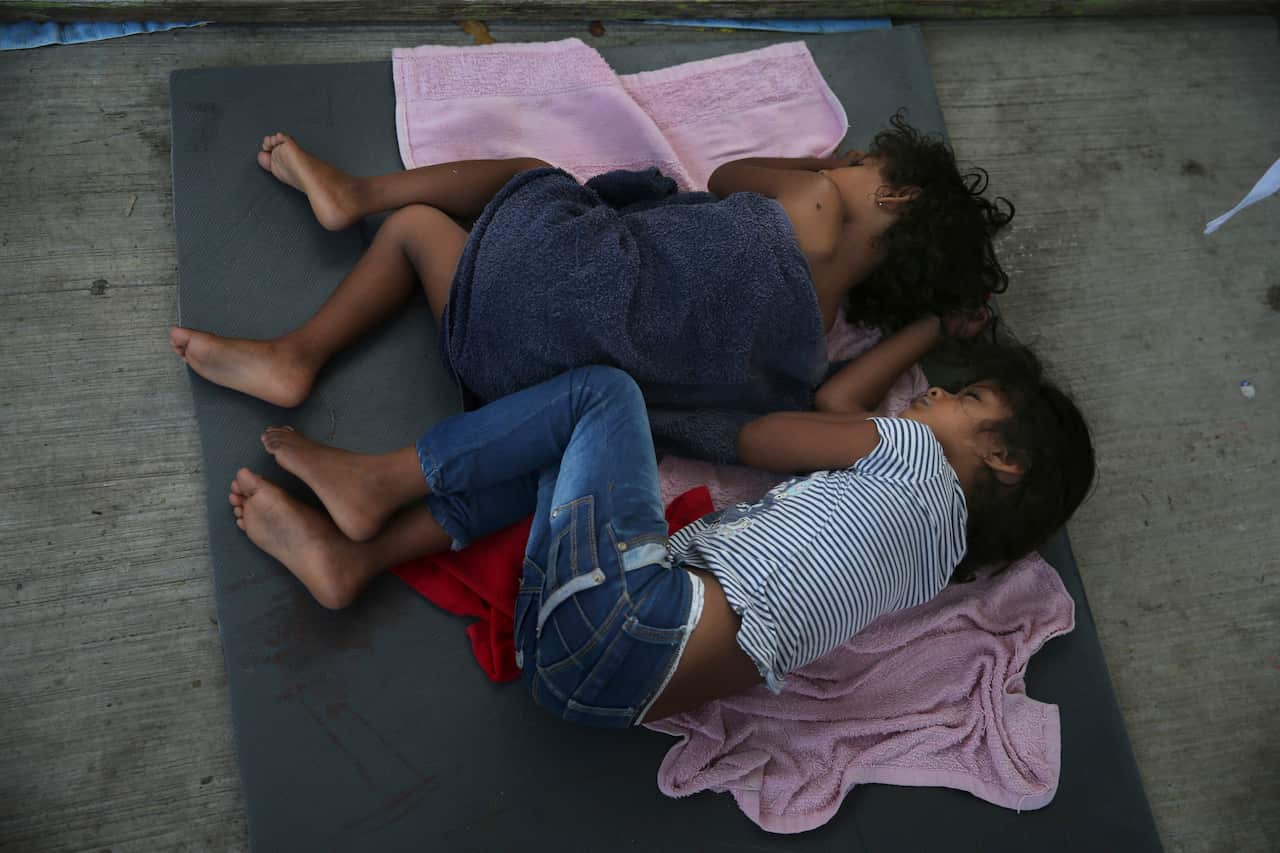 Migrant children sleep on a mattress at a migrant shelter in Nuevo Laredo, Mexico in July, 2019. 