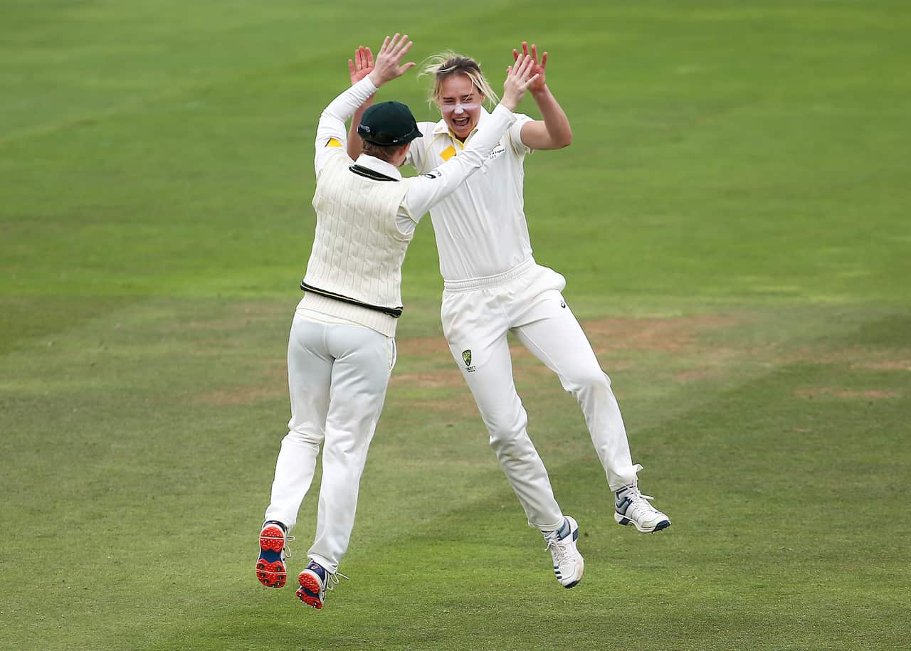 Australia's Ellyse Perry celebrates taking the wicket of England's Tammy Beaumont during day three.