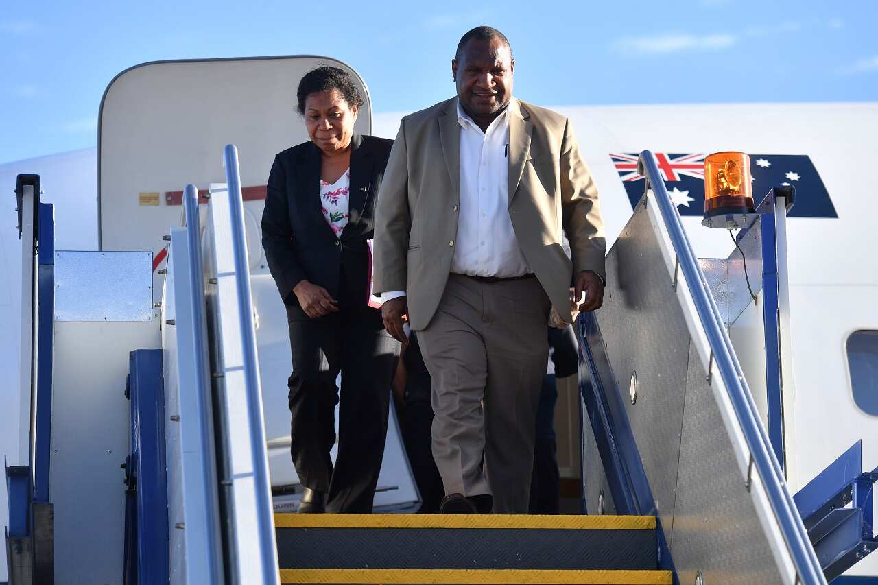 Papua New Guinea's Prime Minister James Marape and wife Rachel Marape arrive at Canberra.