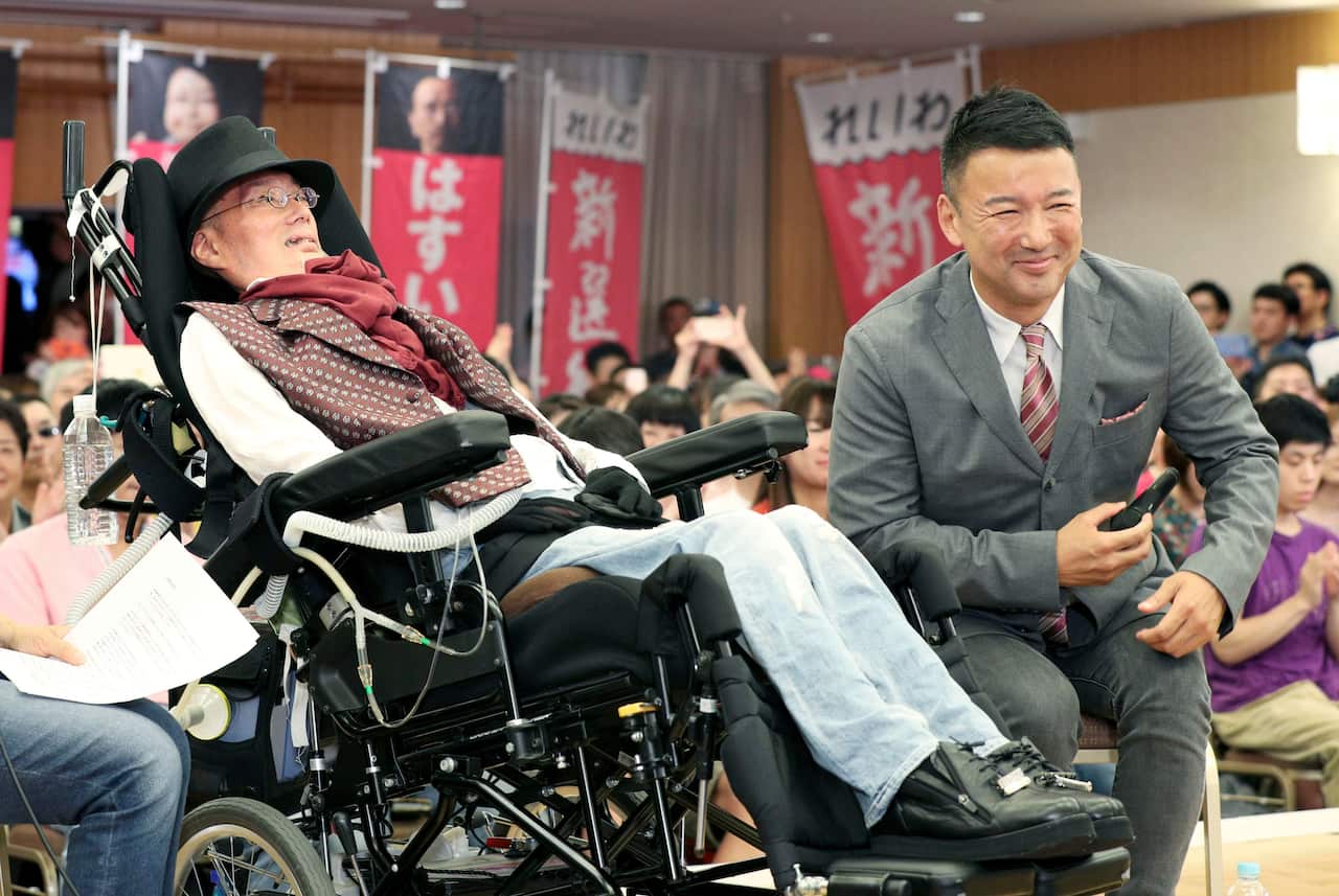 Yasuhiko Funago (left) with Taro Yamamoto.