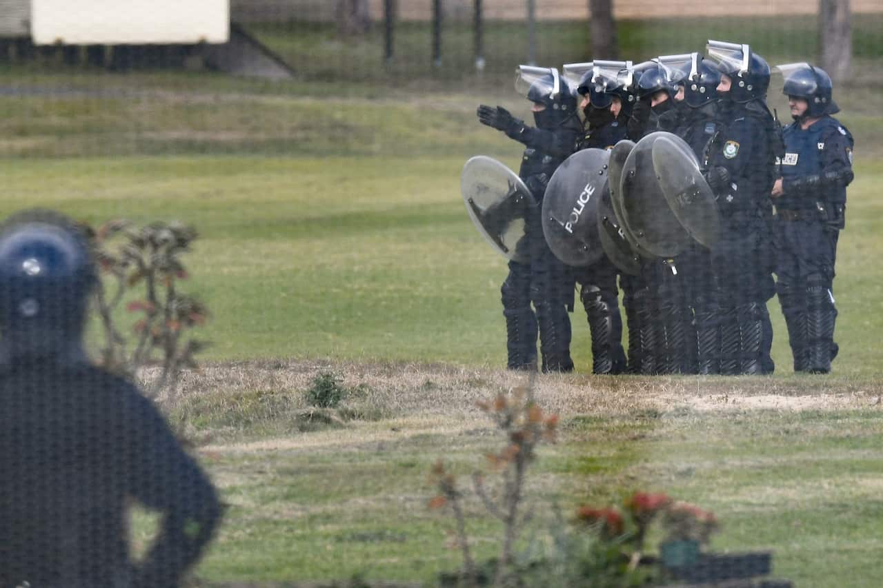 Riot Police are seen during a riot at the Frank Baxter Juvenile Justice Centre.